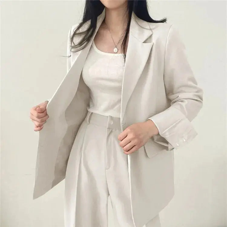 Fashionable women's tailored outfit, an elegant blazer and trouser combination.