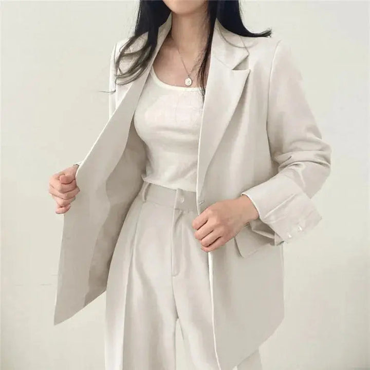 Fashionable women's tailored outfit, an elegant blazer and trouser combination.