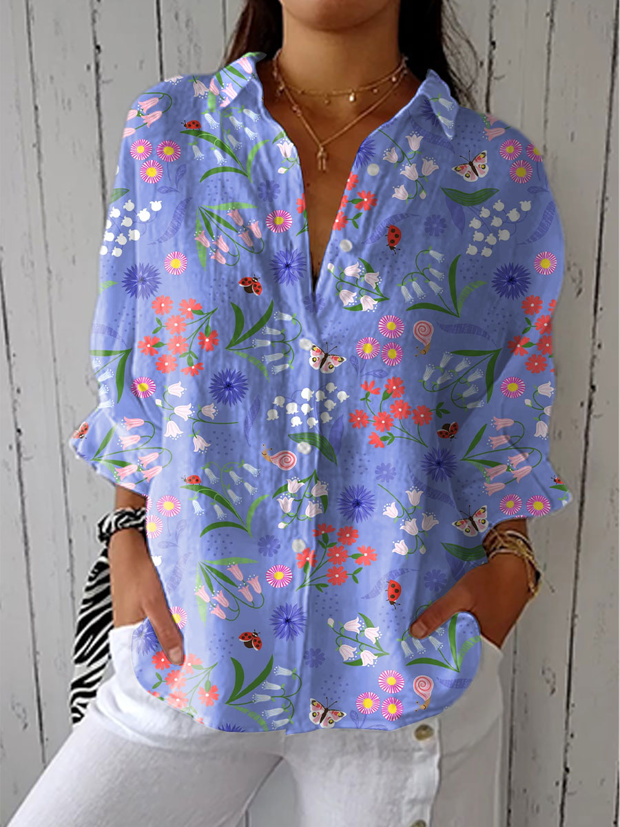 Elegant Women's purple long sleeve button-down blouse with beautiful meadow floral print, perfect for spring fashion.