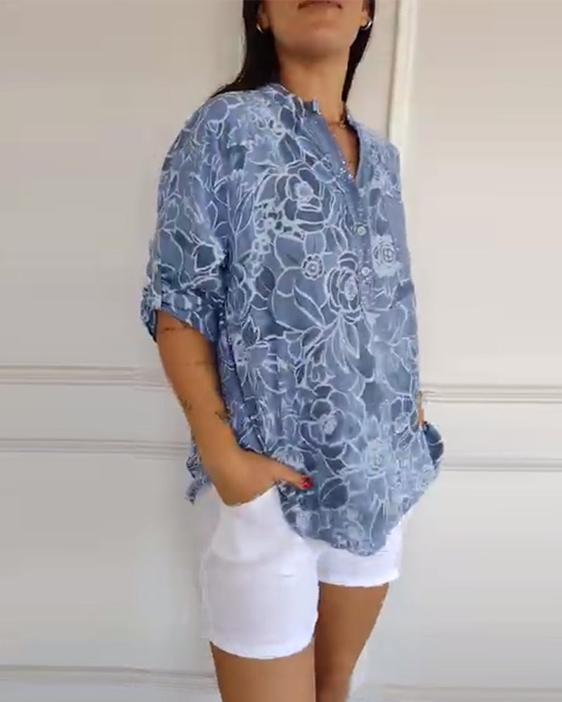 Elegant woman wearing a relaxed fit floral print blouse, suitable for versatile spring outfits.