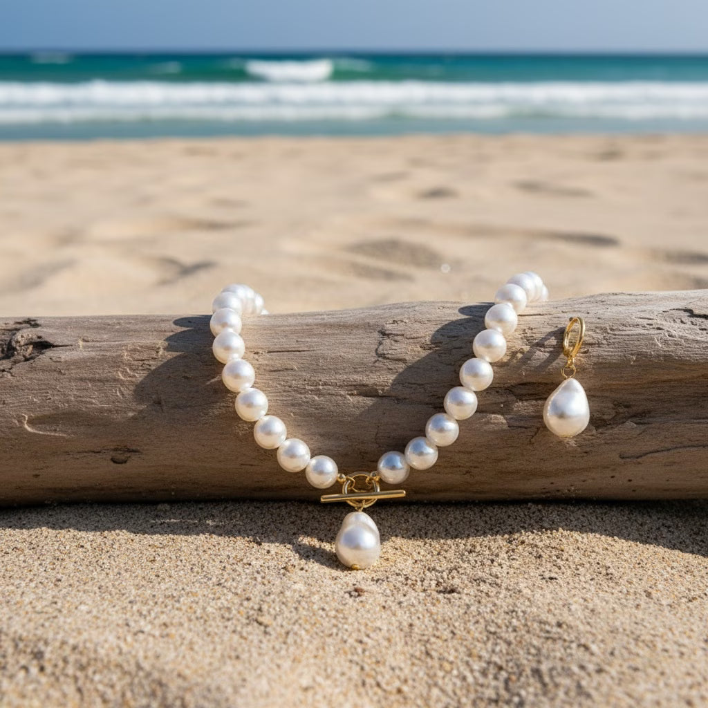 Classic women's pearl jewelry set with a vintage-style necklace and earrings, an essential accessory.