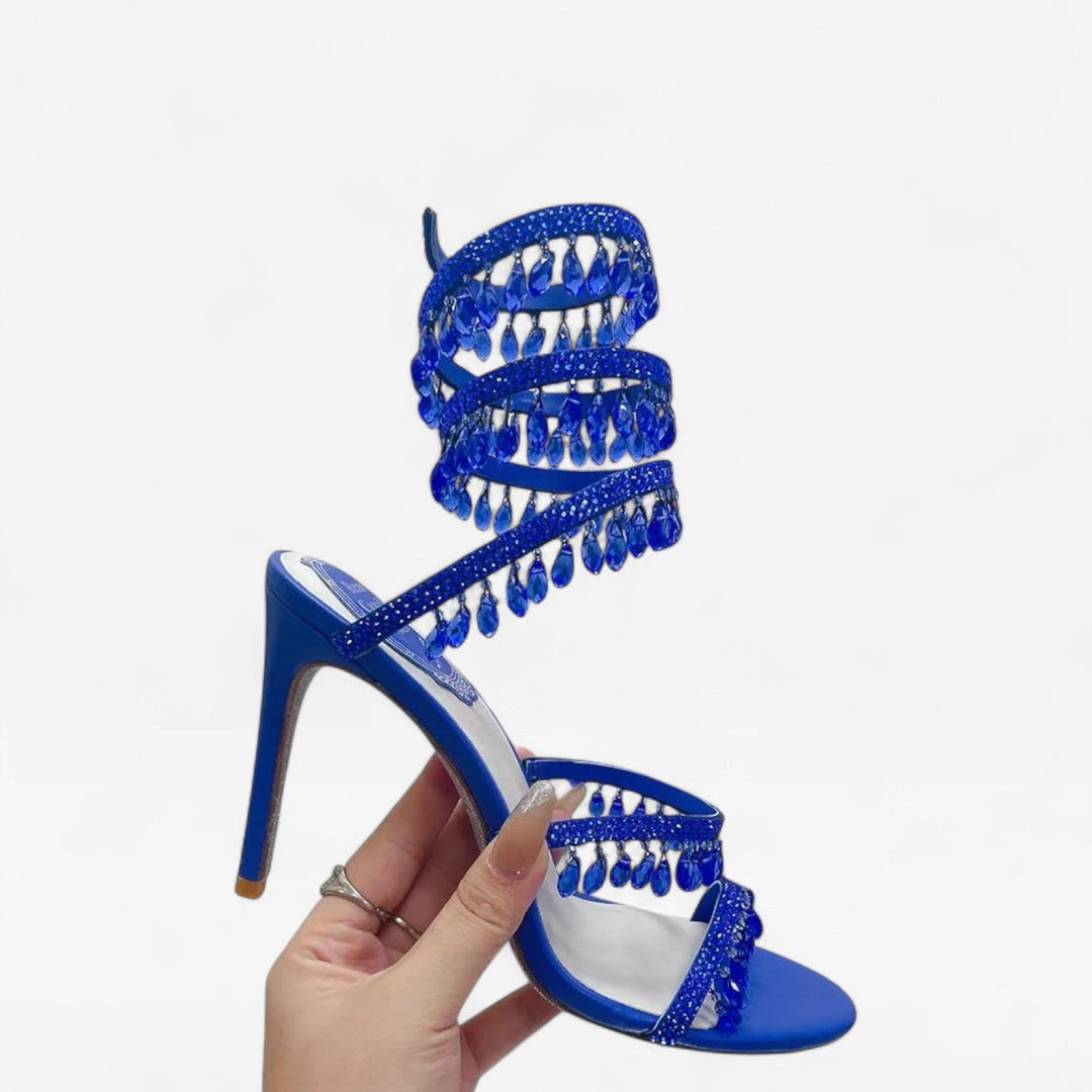 Eye-catching crystal-studded strappy high heels for women's glamorous evening parties.