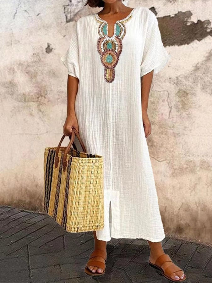 Women's flowy caftan dress with chic ethnic details, perfect for summer fashion & beachwear. Relaxed fit maxi.