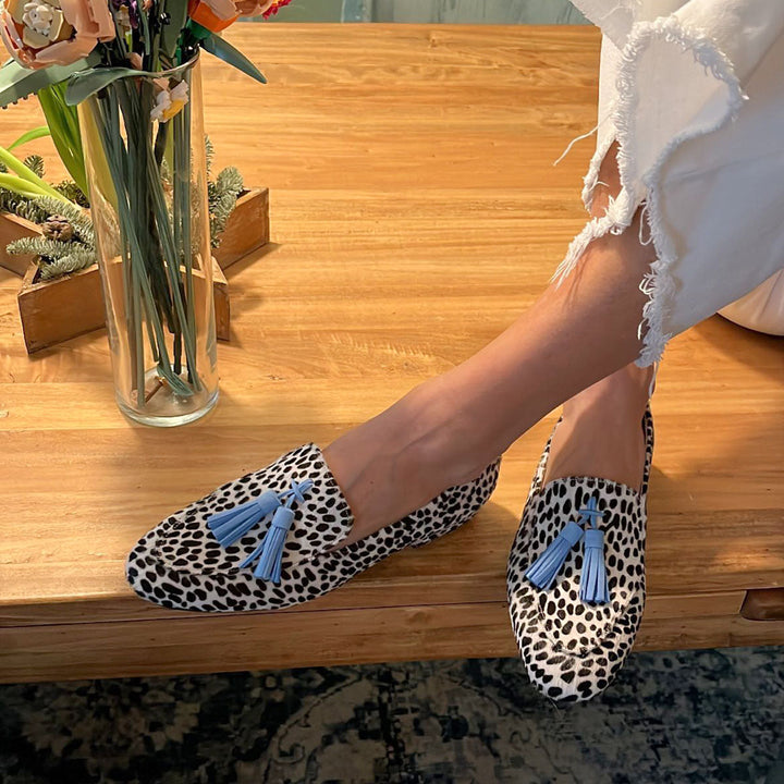 Stylish women's fringe moccasins in a unique pattern, perfect for casual chic everyday comfort. Slip-on flat shoes.