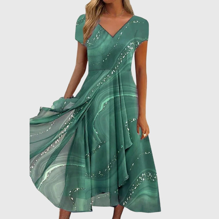 Stylish women's flowing midi dress featuring a V-neck, great for summer fashion, parties, or everyday elegance.