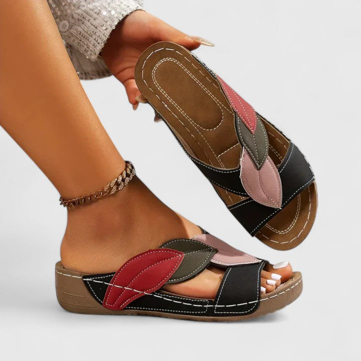 Pair of women's casual summer sandals with non-slip sole & orthopedic arch support for daily wear.
