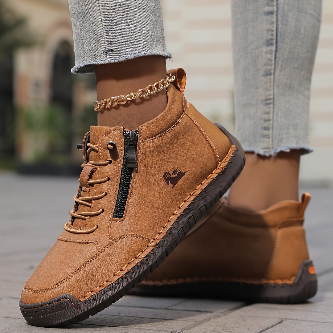 Stylish women's high-top sneakers with zip and laces, ideal for casual and active wear.