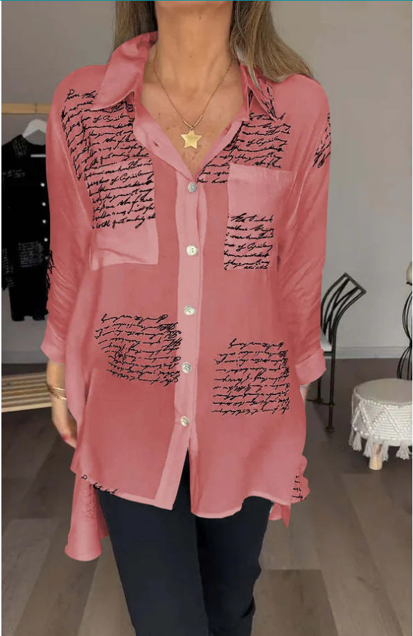 Detailed script print on a women's oversized button-up shirt. Comfortable long sleeve blouse, great for layering.