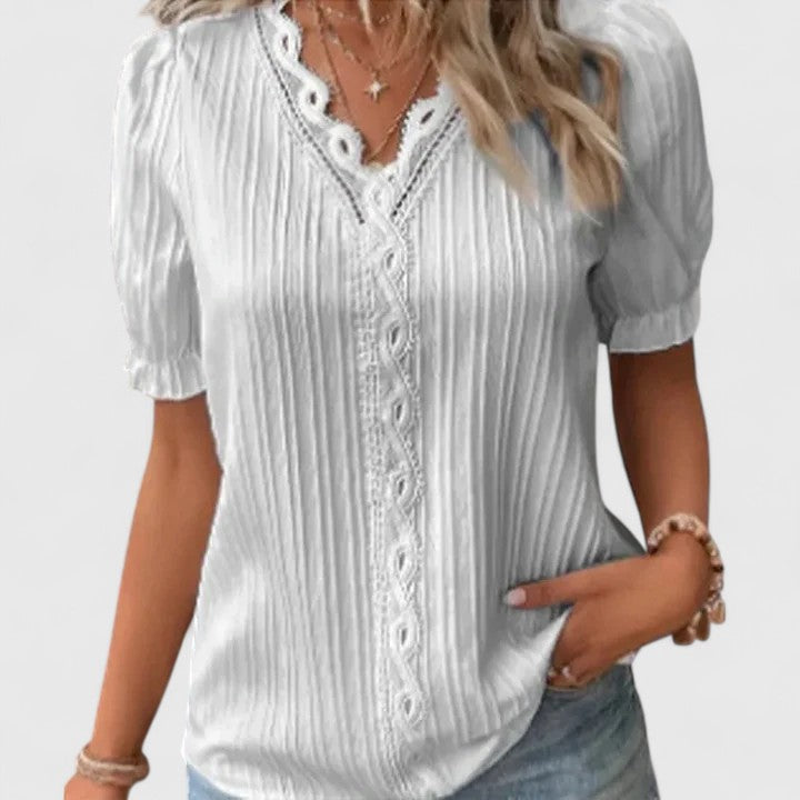 Front view: Women's elegant V-neck short sleeve blouse, chic for summer fashion. Relaxed fit & hollow detail.