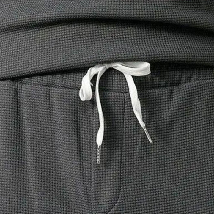Soft men's relaxed fit tracksuit. Two-piece pullover and elastic waist pants for ultimate comfort loungewear.