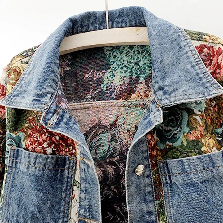 Boho chic women's denim jacket with vibrant hand-painted floral design. Perfect casual outerwear.