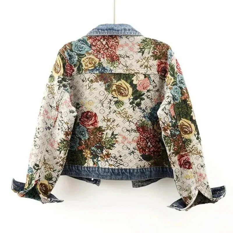 Women's hand-painted floral denim jacket. Unique artistic style for spring and fall fashion.