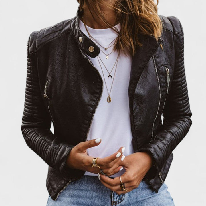 Women's black asymmetrical zipper jacket with stand collar. Trendy fitted long-sleeve outerwear for casual chic fashion.