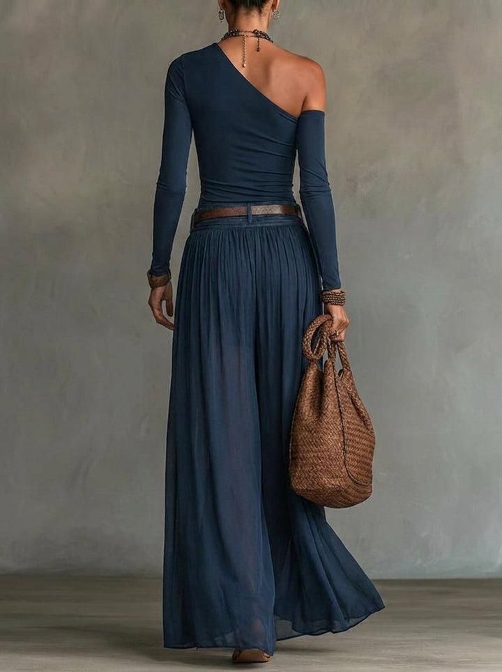 Formal navy two-piece outfit with an asymmetrical design for women. Elegant party wear.