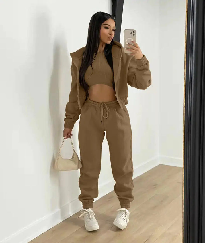 Comfy chic women's 3-piece set: cropped hoodie, joggers, & bralette for relaxed fit.