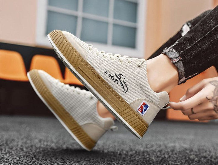 Modern men's low top sneakers with quilted finish and laces. Non-slip platform for daily comfortable wear.