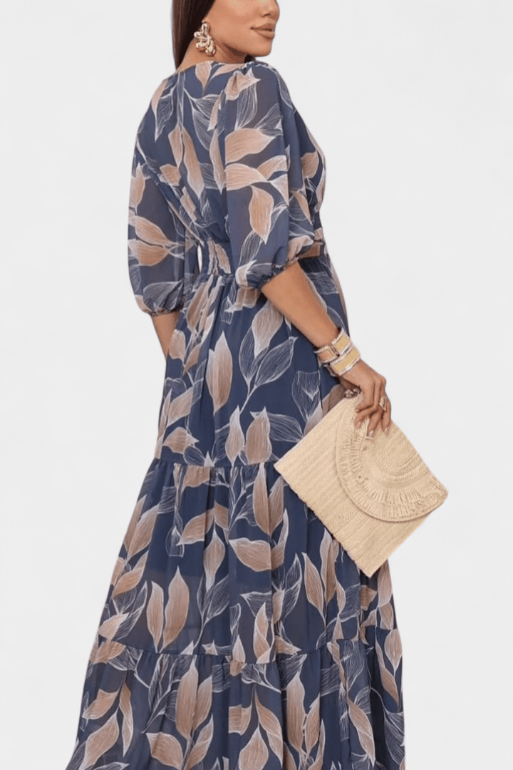 Chic women's printed maxi dress, V-neck, long sleeve. Comfortable & elegant for all-day wear.