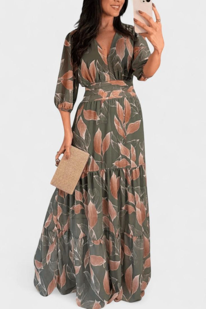 Elegant women's V-neck printed maxi dress. Flowing design, ideal for spring/summer casual wear.