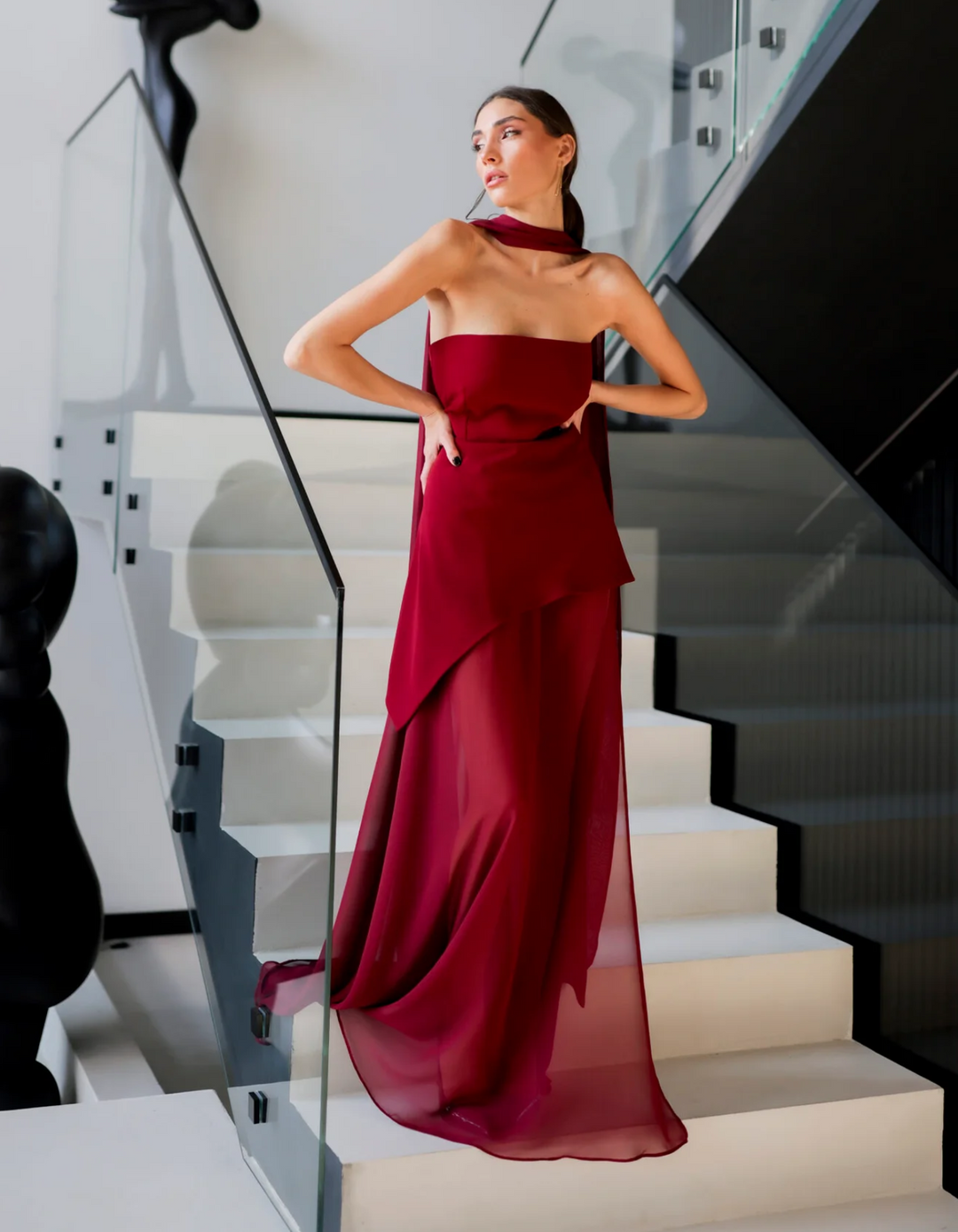 Chic women's strapless maxi dress in motion, showcasing a flowy silhouette. Perfect for evening & summer events.