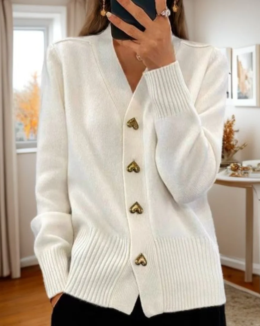 Women's elegant long sleeve v-neck cardigan, featuring romantic heart buttons. A cozy and stylish fashion sweater.