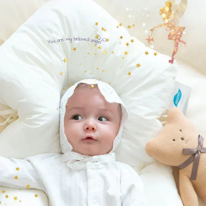 Newborn ergonomic cuddle cushion for safe sleep support. Portable and antibacterial for infant comfort anywhere.