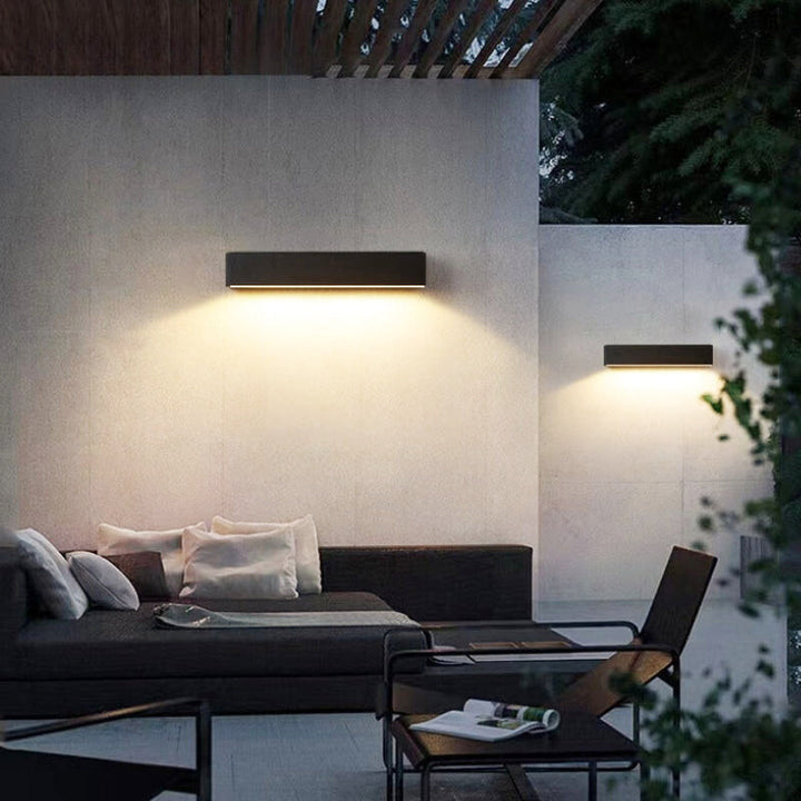 Contemporary solar LED wall light, IP65 waterproof, wireless, ideal for garden & pathway illumination.