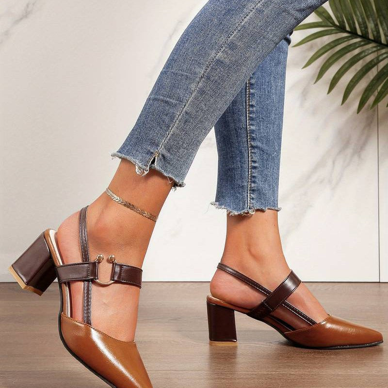 White women's orthopedic block heels with pointed toe, offering all-day comfort for formal occasions.