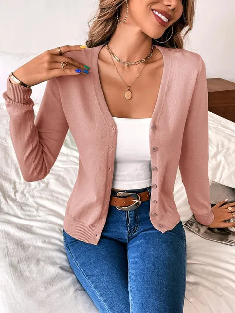 Cozy women's v-neck knit sweater in burgundy. Elegant long sleeve button-front design for fall and winter.