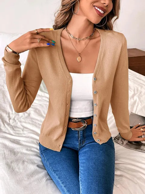 Cozy women's gray v-neck knit sweater. Soft long sleeve button-front top for comfortable everyday style.