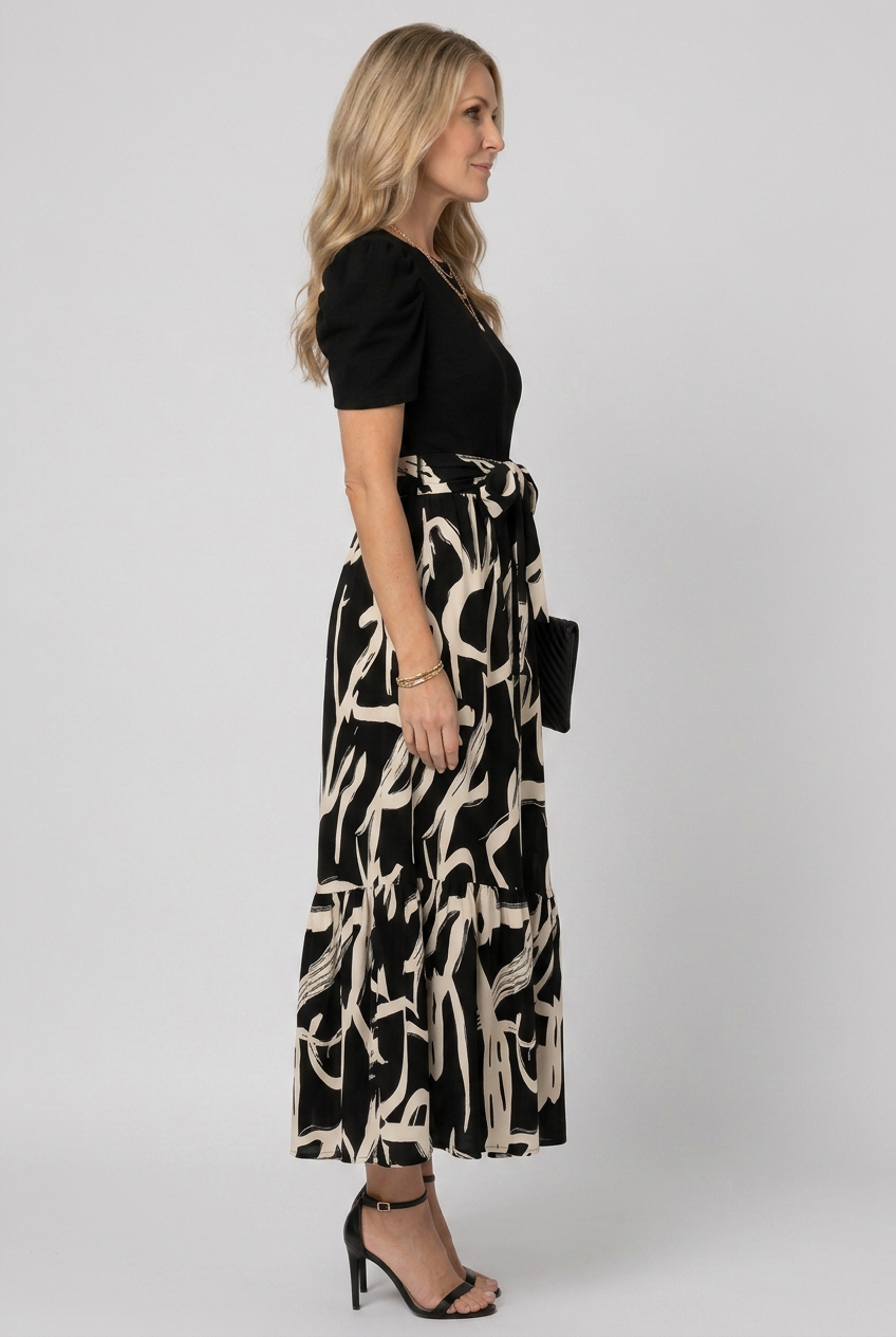 Flowing Avelyn women's maxi dress featuring an abstract floral print, short sleeves, great for casual elegance.