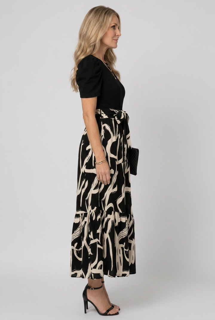 Flowing Avelyn women's maxi dress featuring an abstract floral print, short sleeves, great for casual elegance.