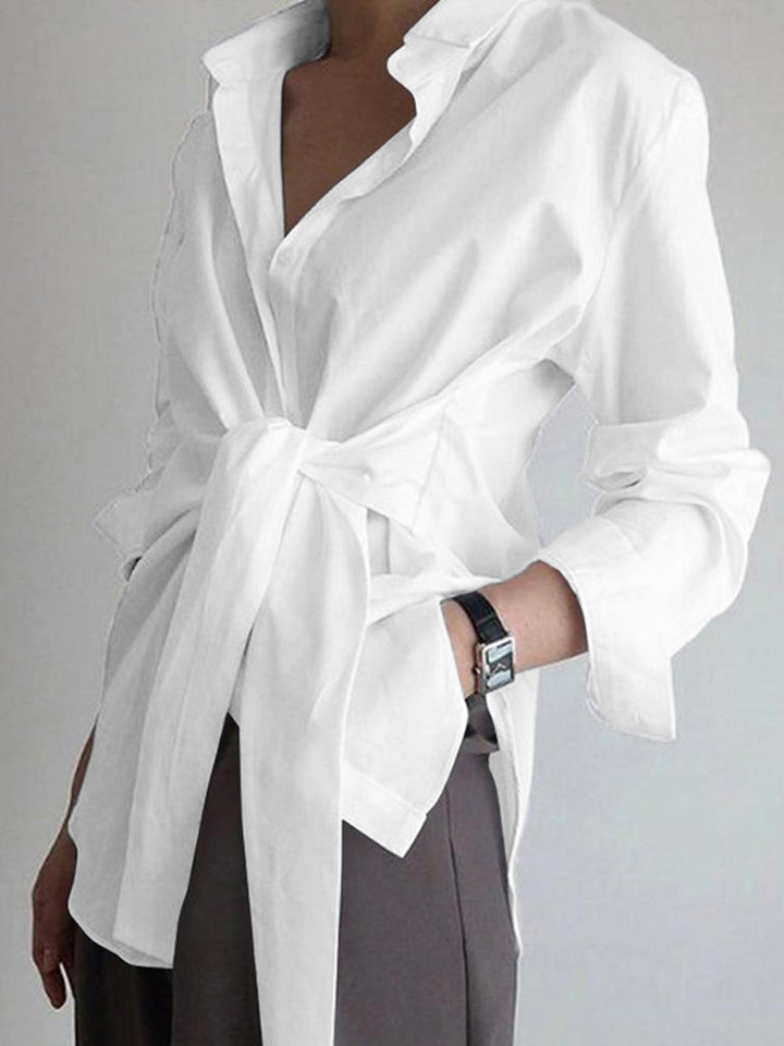 Fashionable women's elegant tie-waist top. A versatile long-sleeve wardrobe staple for any occasion.