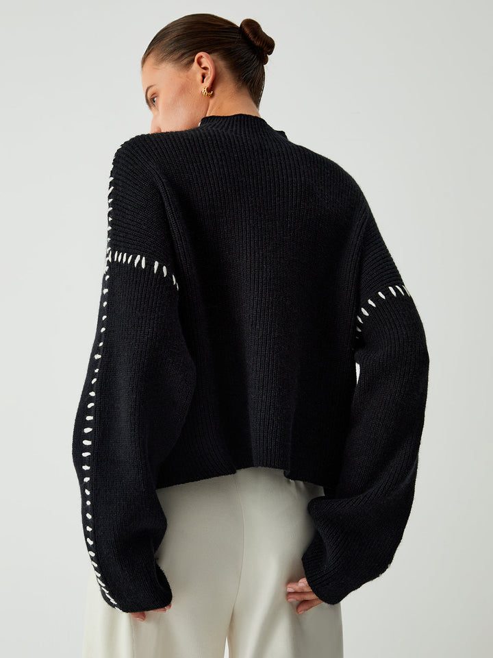 Relaxed fit women's oversized jumper with eye-catching contrast stitching, a must-have for winter fashion.