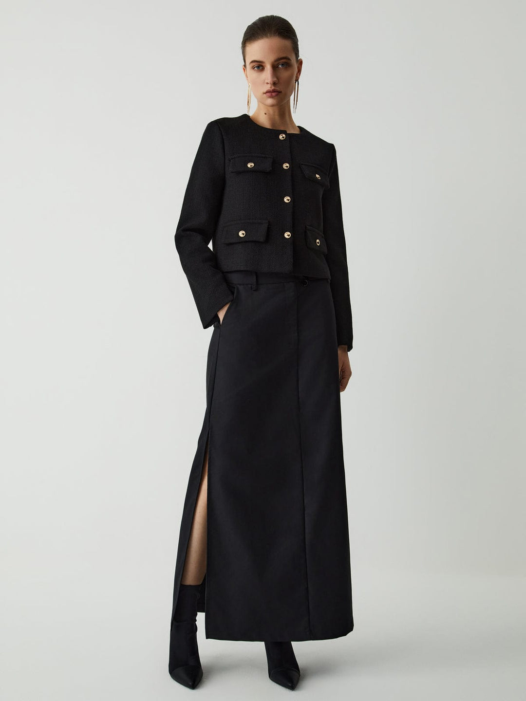 Modern women's cropped blazer, tailored fit, gold buttons, long sleeve, sophisticated workwear.