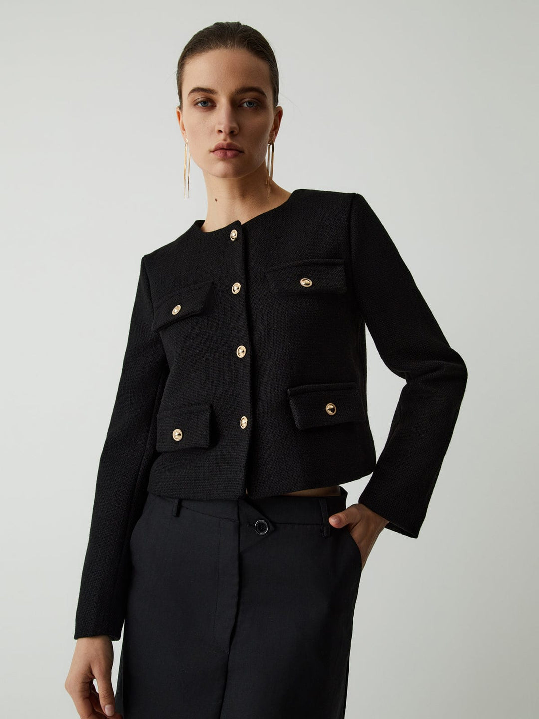 Modern classic women's cropped blazer, gold buttons, tailored, ideal for smart casual or work.