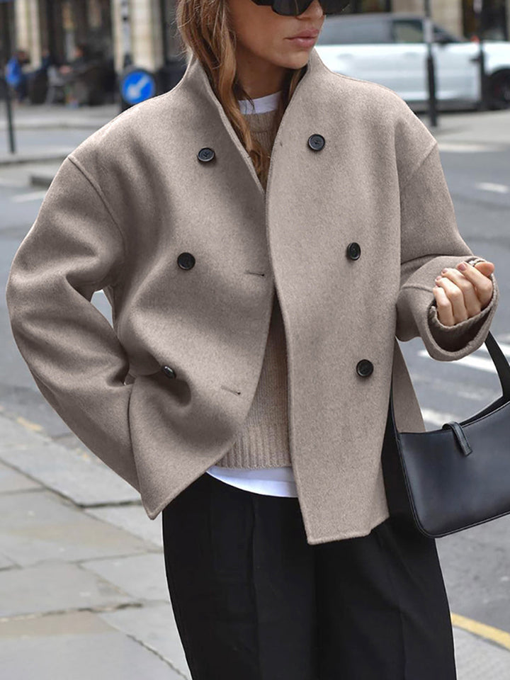 Fashionable women's loose fit jacket with button closure, perfect for stylish fall and winter versatility.