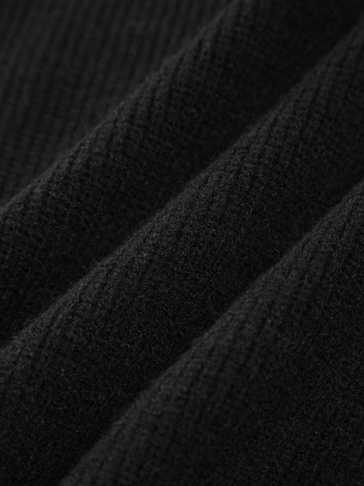 Versatile women's oversized knit top with detailed contrast stitching, offering a chic and relaxed fit.