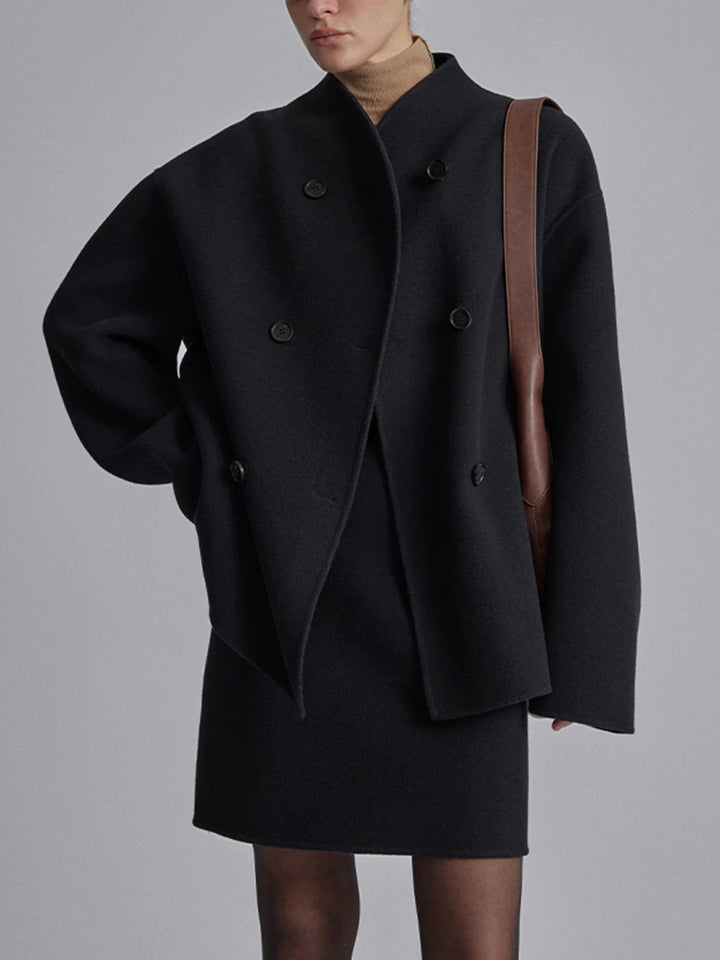 Full-length view of a women's double-breasted pea coat. Stylish winter outerwear, classic design, relaxed fit.