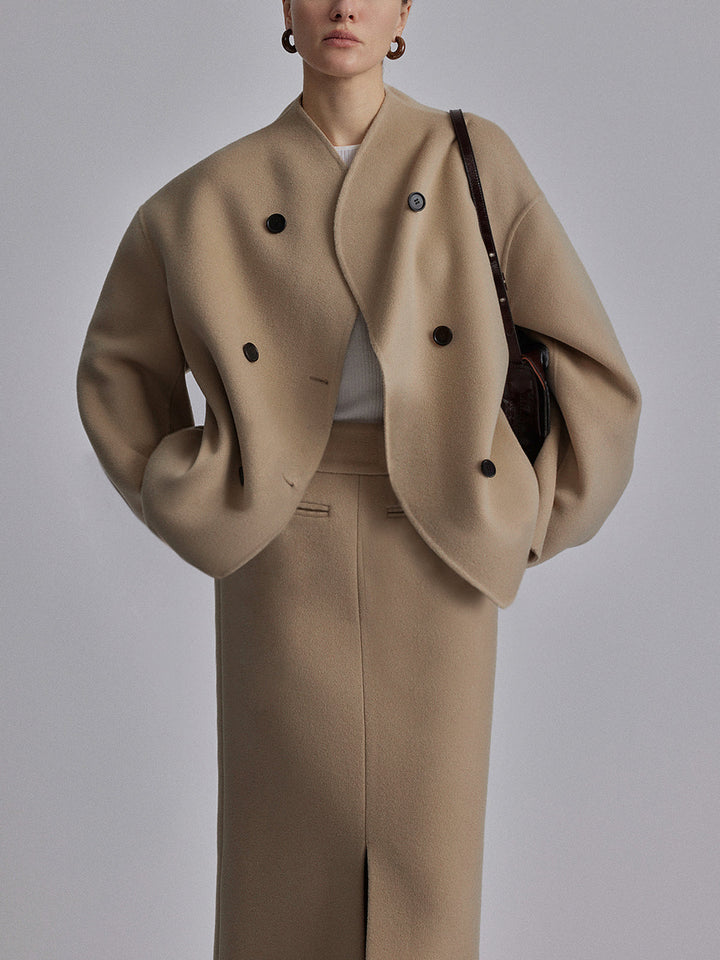 Detail of a women's double-breasted pea coat buttons and stand collar. Elegant classic winter jacket.