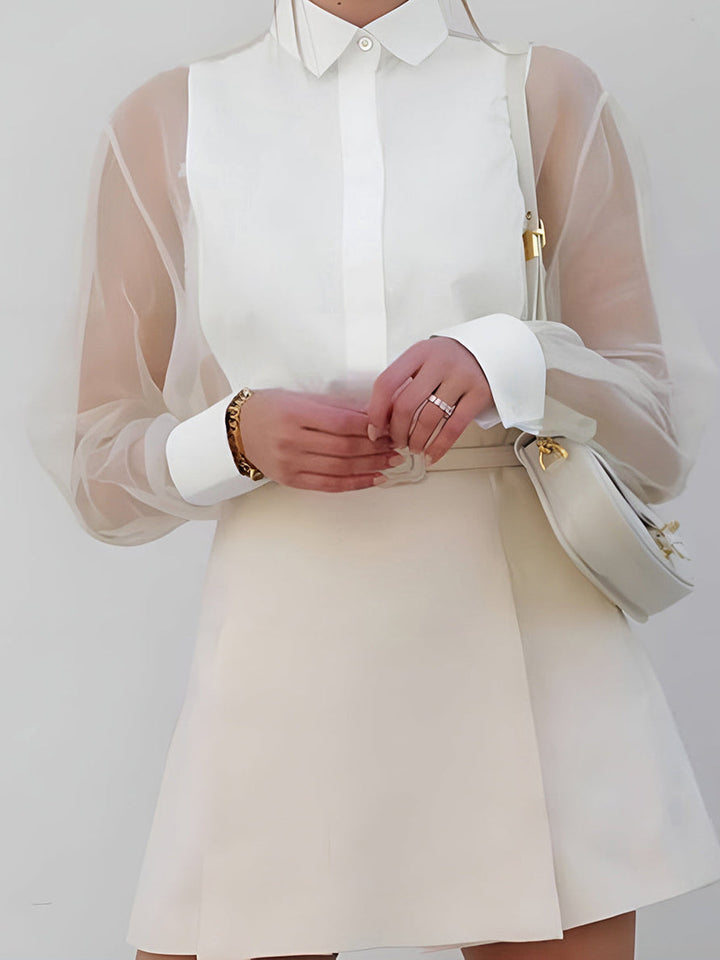 White women's sheer sleeve button-up shirt, an elegant long sleeve blouse perfect for office wear or chic spring style.
