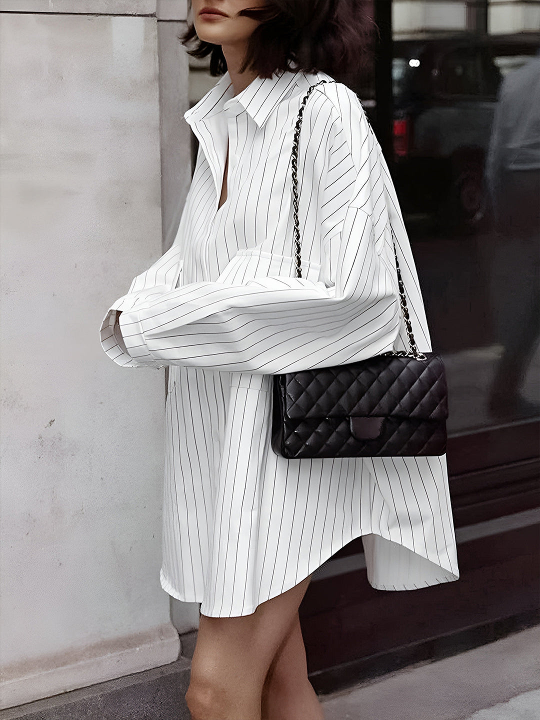 Stylish women's oversized striped dress. Long sleeve button-down design for a relaxed yet chic spring and summer look.