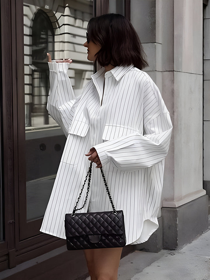 Fashionable women's striped shirt dress. Oversized, long sleeve, button-down for chic casual spring and summer outfits.
