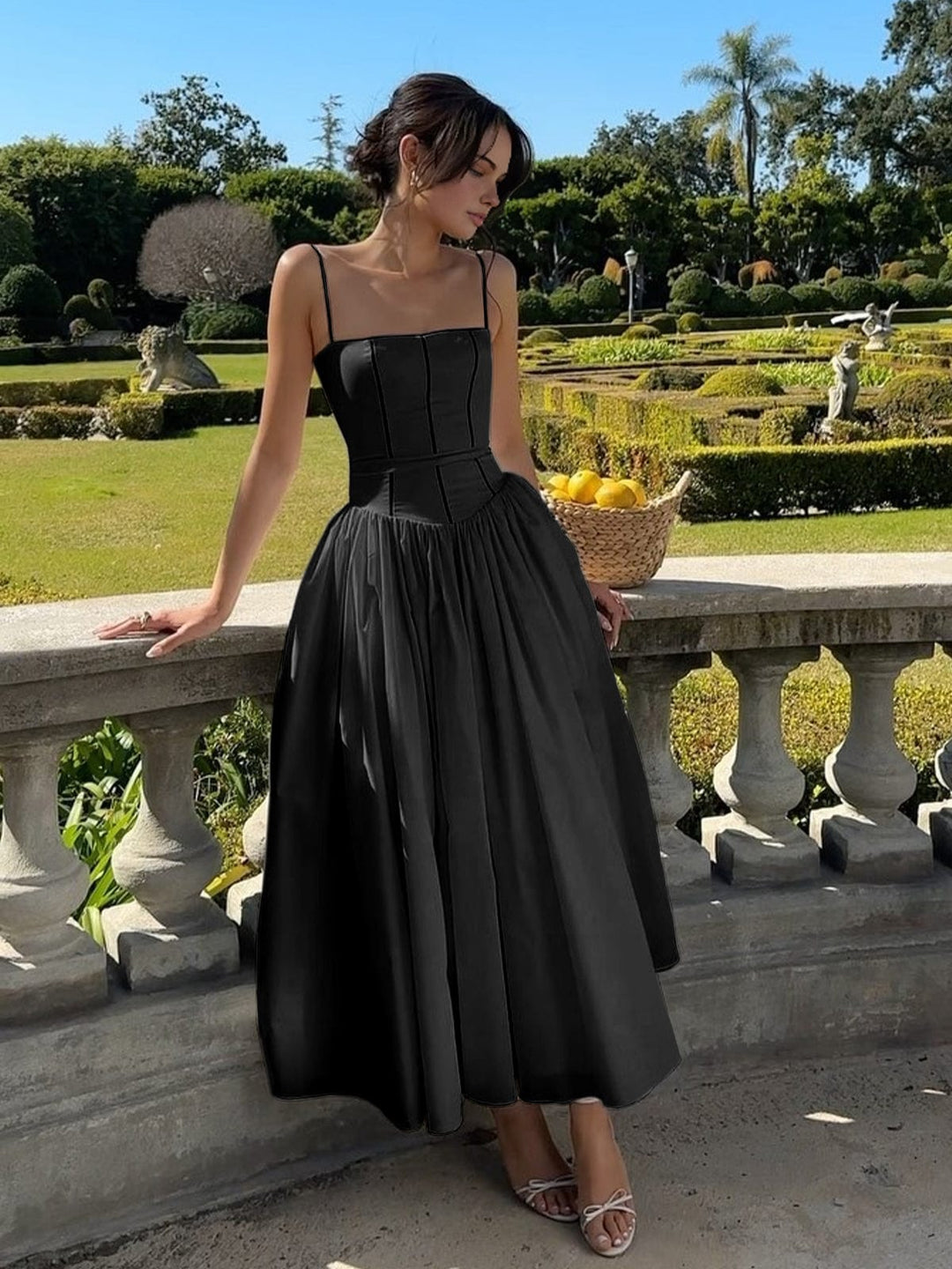 Elegant black sleeveless midi dress for women, perfect for summer parties, vacations & chic occasions.