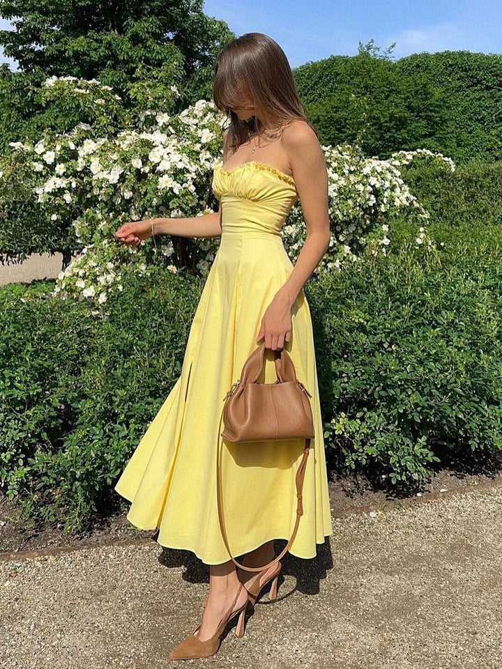Women's breezy maxi dress with a sweetheart neckline and flowing A-line skirt, perfect for summer.