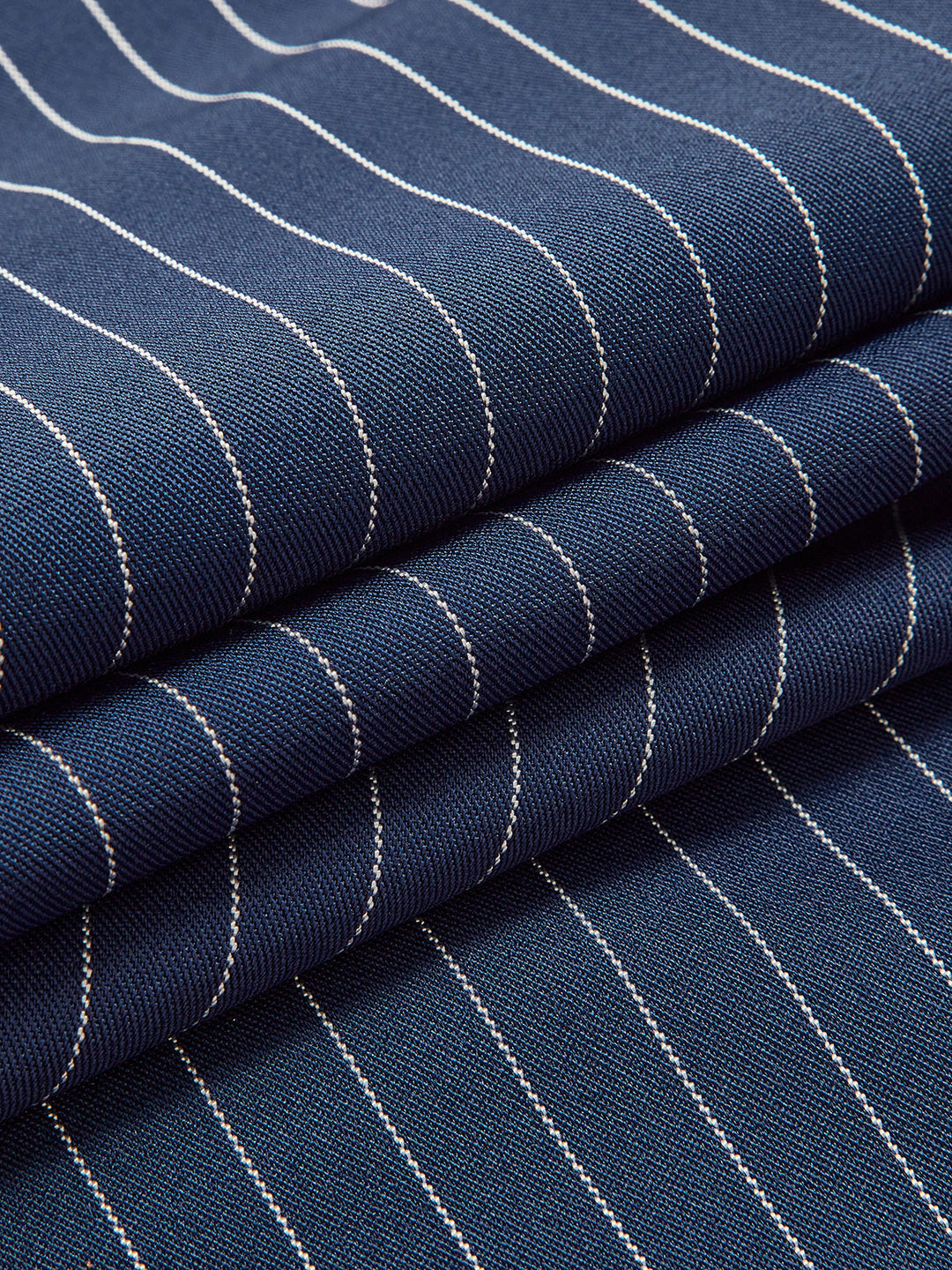 Detailed view of women's high waist wide leg pinstripe trousers, showing fabric and tailored fit.