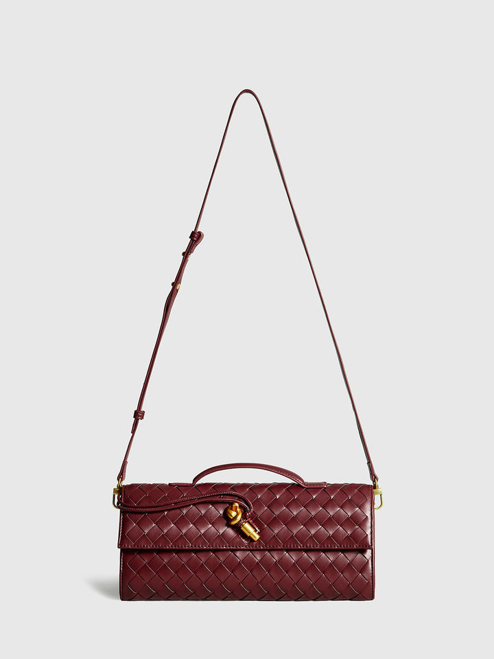 Women's versatile woven flap clutch bag in wine red. Converts to a stylish shoulder purse.