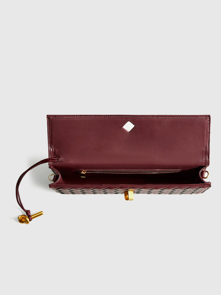 Sophisticated wine red woven flap shoulder bag & clutch. Perfect for women's evening fashion.