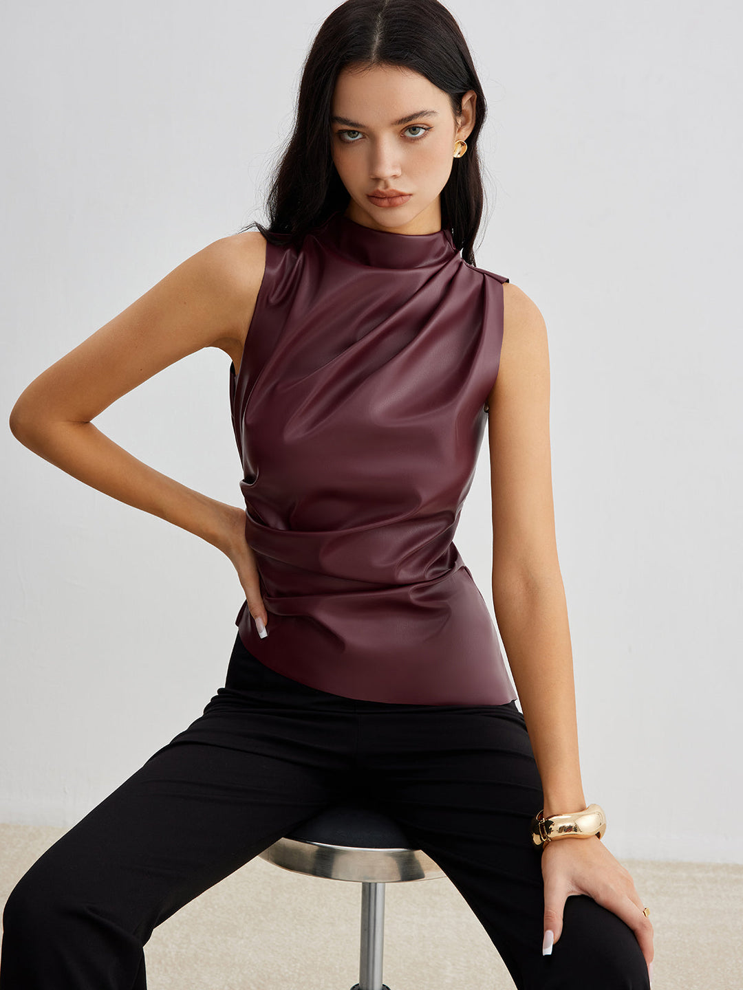 Elegant women's high neck drape sleeveless top, perfect for modern chic and office wear.