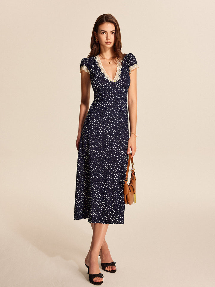 Chic polka dot midi dress for women, featuring delicate lace trim and fashionable puff sleeves; ideal for spring occasions.