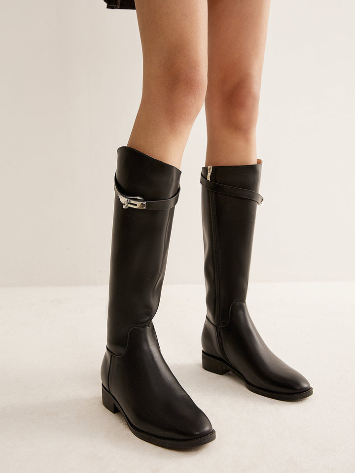 Stylish women's black knee-high riding boots, featuring a round toe, ideal for fall & winter fashion.